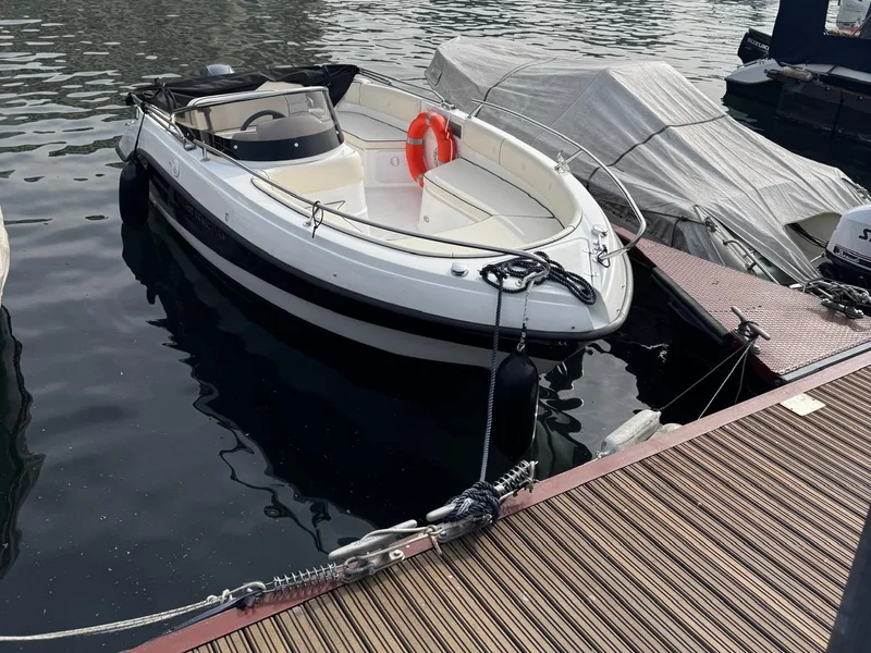 Classic fiberglass lancia boat on Lake Como with sundeck